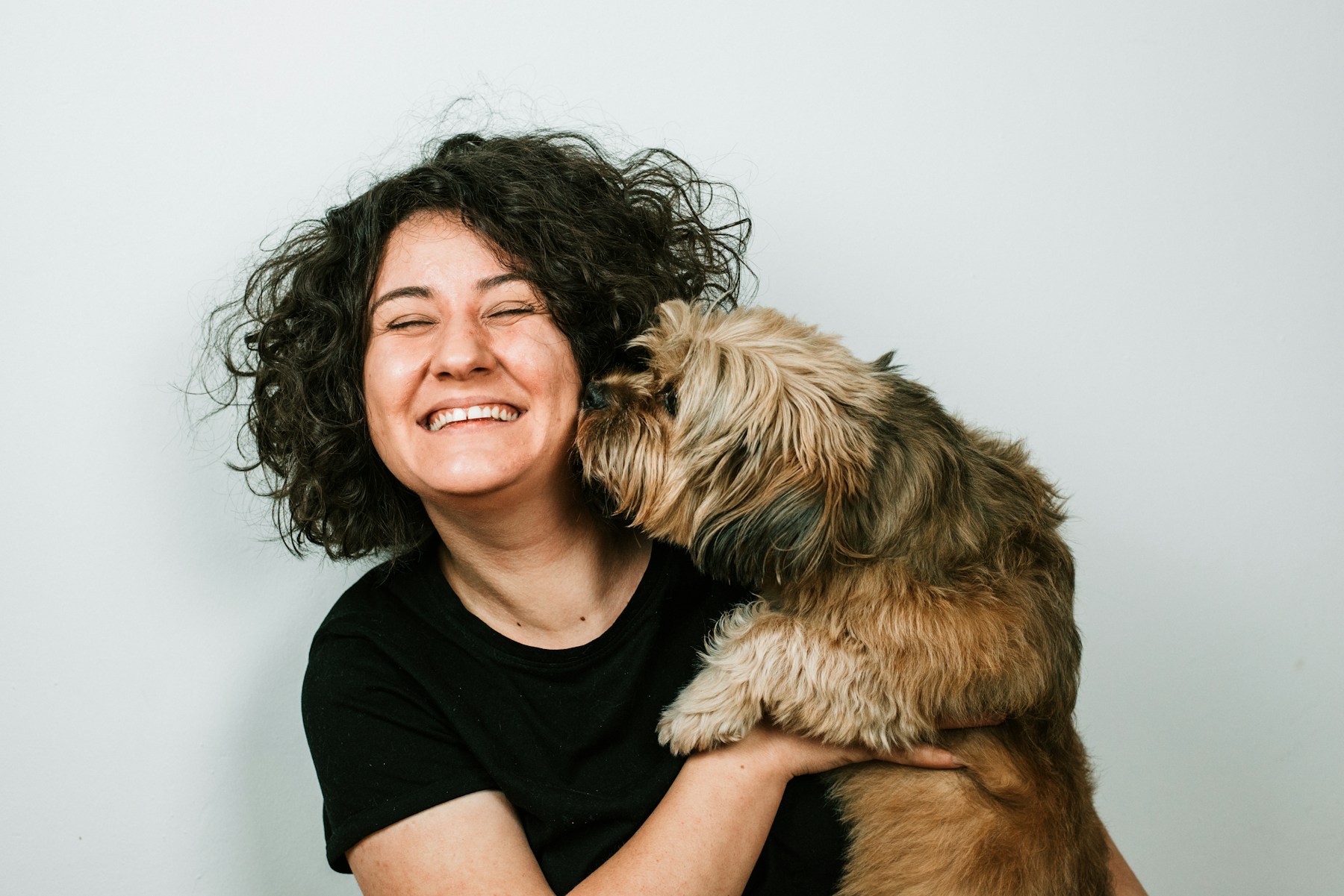 Real dog owner sharing a close moment with her dog